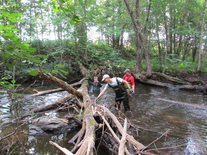 Mike Stone, Noel Craig and Jeff Stone work to clear another log jam