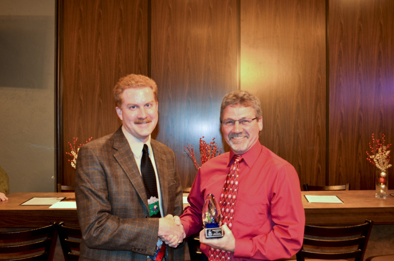 Jim VandenBranden accepts the award on Triangle Distributing’s behalf