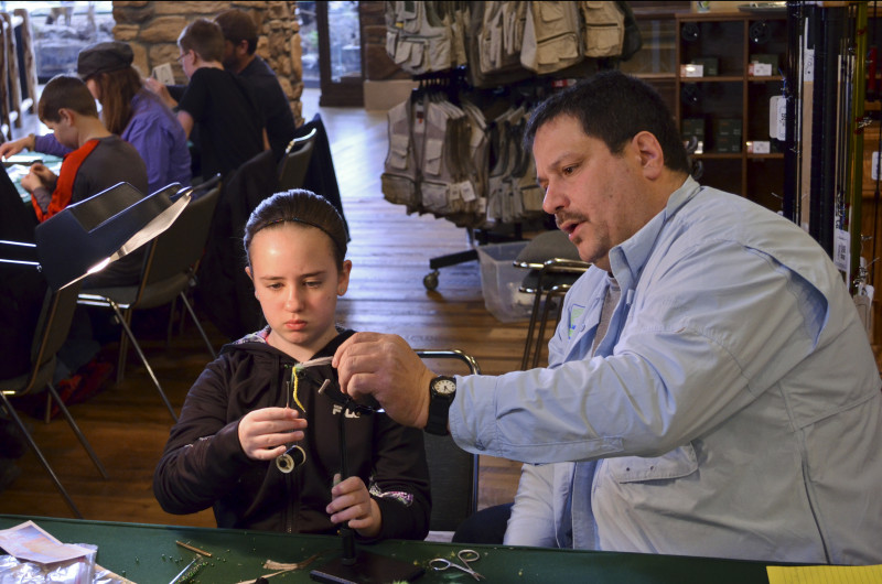 Paul and young lady work on mastering the bobbin