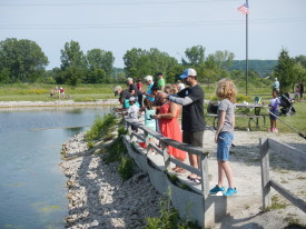 Volunteers and optimistic anglers ready for fish.