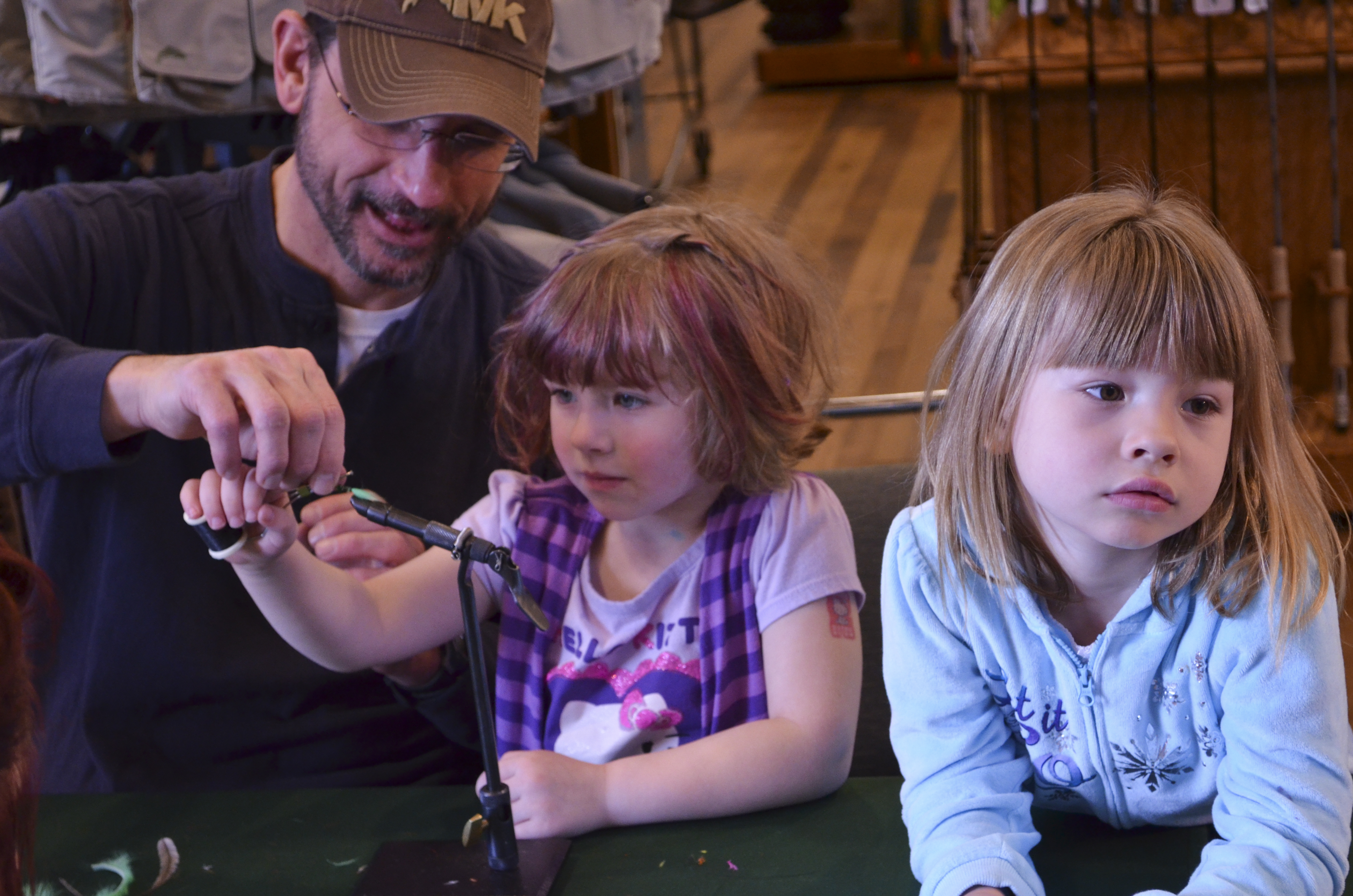 Dave helping sisters tie their first fly. Boring....